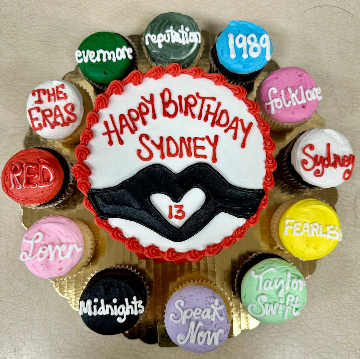 Taylor Swift Era's Cake & Surrounding Cupcakes
